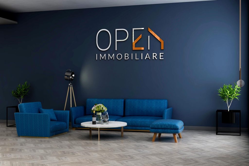 Progettazione logo agenzia immobiliare insegna su parete ufficio